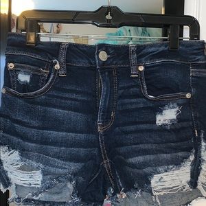 dark blue shorts with rips